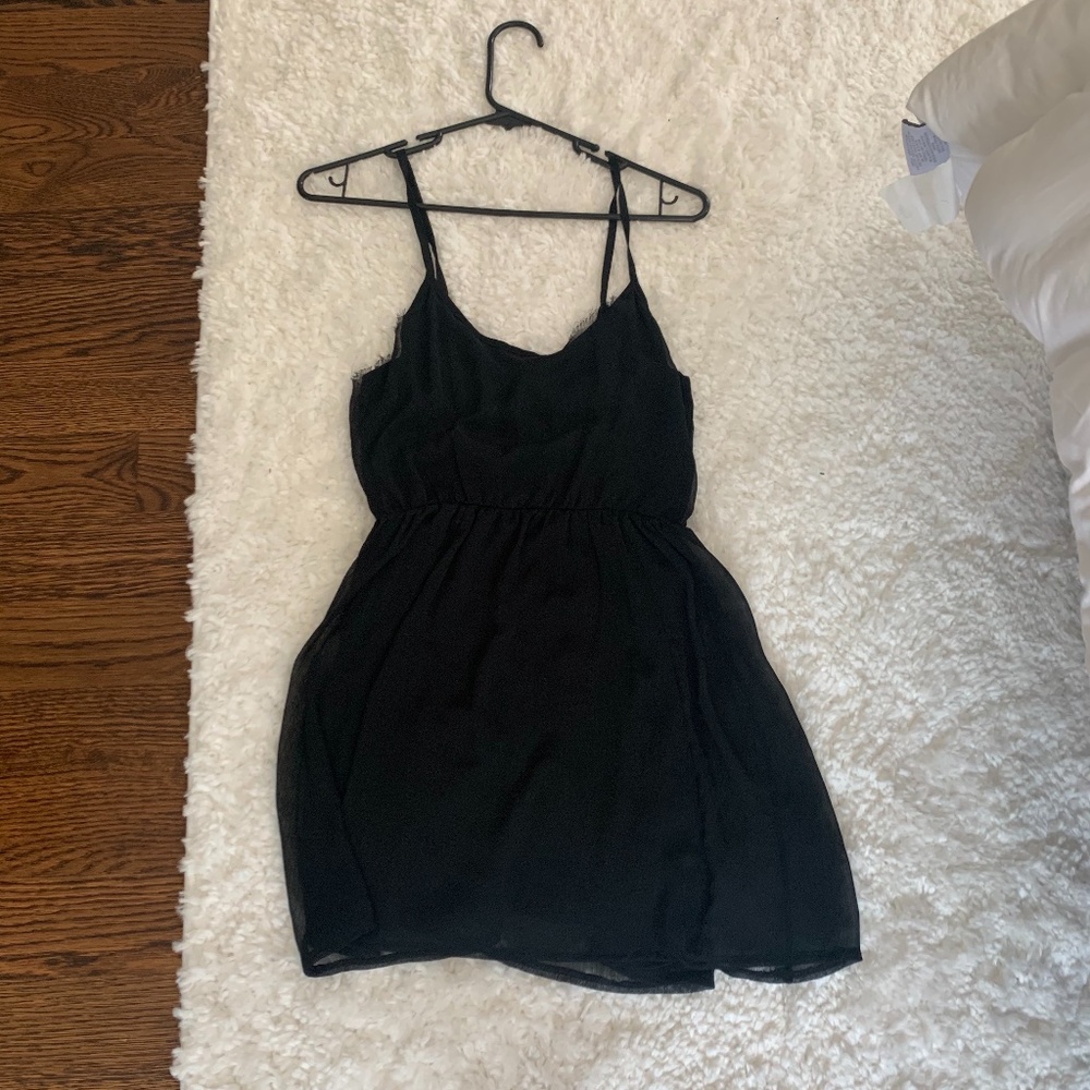 Black Dress size Large with spaghetti straps. Plea